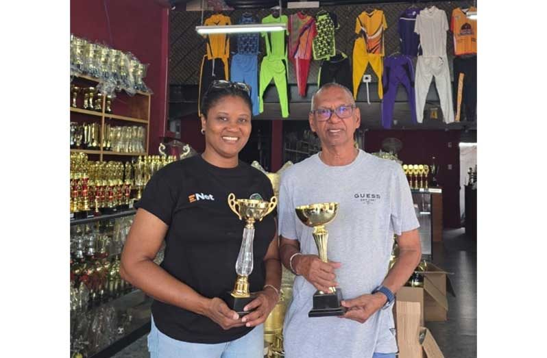 A representative of the GSA poses with Trophy Stall proprietor Ramesh Sunich