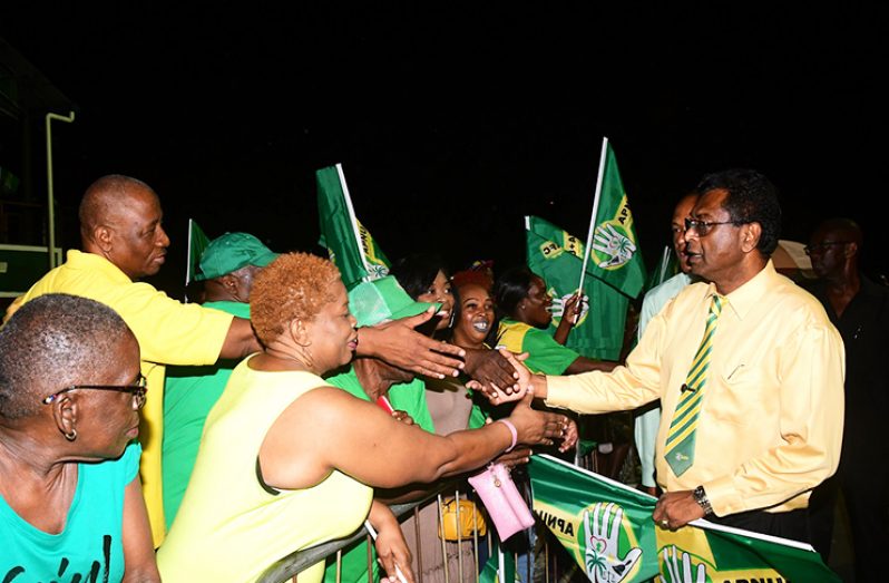 AFC Leader, Khemraj Ramjattan interacts with supporters at the APNU+AFC campaign launch on Friday evening at D’Urban Park.(Adrian Narine  photo)