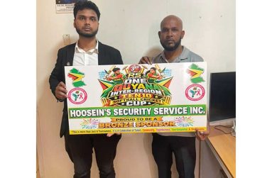 Chief Financial Officer of Hoosein’s Security Service Mr. Ritesh Ramkissoon (left) hands over sponsorship to the manager of RS Sports, Mr. Abel Seetaram