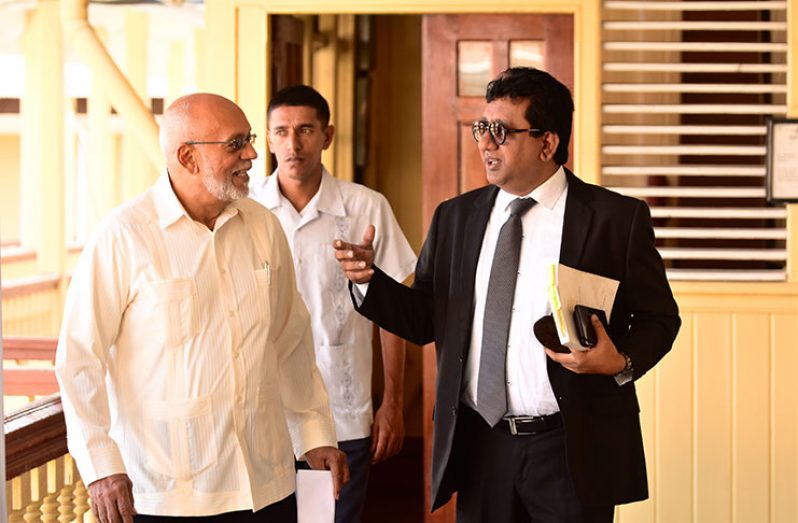 Former President Donald Ramotar on his way to be cross examined in the High Court by the Attorney General, Basil Williams. In this photo, he is accompanied by his attorney, Anil Nandlall
(Photos by Samuel Maughn )