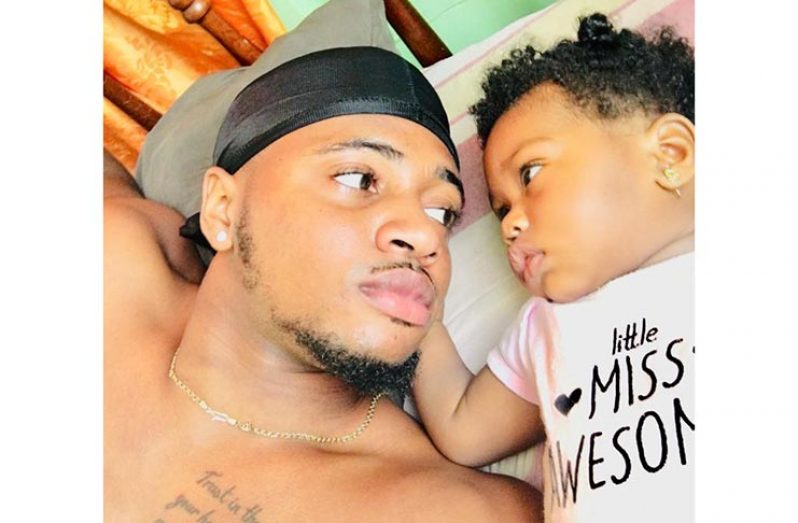 21-year-old Jumul Rampersaud with his daughter