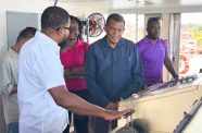 Minister within the Ministry of Public Works, Madanlall Ramraj, inspects the Sabanto vessel at the Parika Stelling
