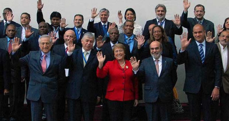 Chilean President, Michelle Bachelet, FAO Director-General, Dr José Graziano da Silva and Venezuela’s Vice-President for Social Matters, Hector Rodriguez (third, fourth and fifth left, respectively) with Agriculture Ministers from the 33 countries that comprise Latin America and the Caribbean (LAC), including Guyana’s own Dr Leslie Ramsammy (extreme left, second row)
