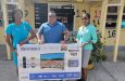 John Ramsingh (centre) of FL Sport alongside the Headmistress of Polly’s Nursey School, Velda Marks (right), and a teacher, Annalesa Hinds, on Tuesday at the school