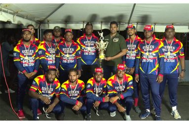 Minister of Culture, Youth and Sport, Charles Ramson Jr hands over the winning prize to Eccles All-Stars