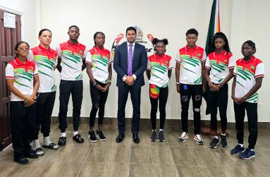 Minister Ramson (centre) along with representatives of Team Guyana