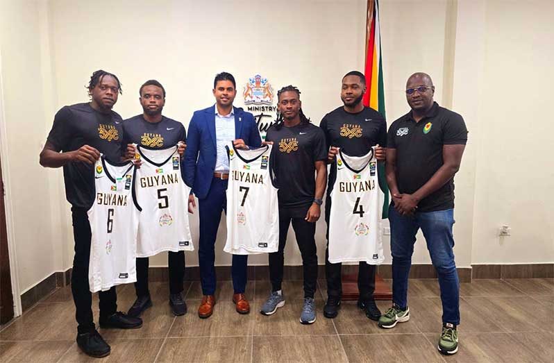 Caption: Guyana’s FIBA 3x3 AmeriCup team (L-R) Harold Adams, Nikkoloi Smith, Dominic Vincente, and Travis Belgrave along with Minister Charles Ramson Jr during the presentation of uniforms