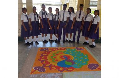 Children from the Abram Zuil Secondary School with their rangoli