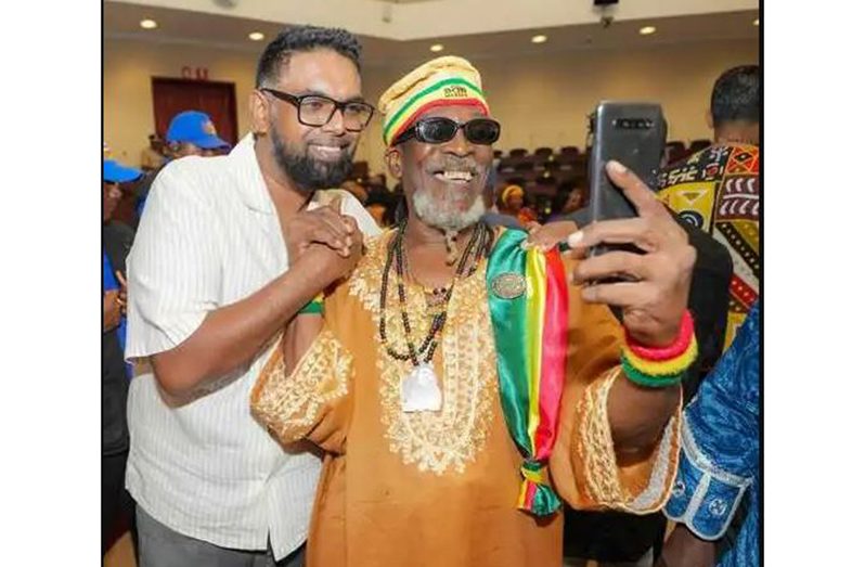 President, Dr Mohamed Irfaan Ali, with a prominent leader of the Rastafarian Community, Ras Leon Saul