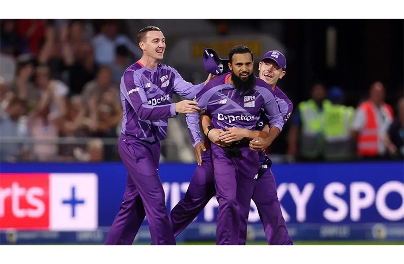 Adil Rashid celebrates with Harry Brook and Matthew Potts after dismissing Jacob Bethell • (ECB via Getty Images)