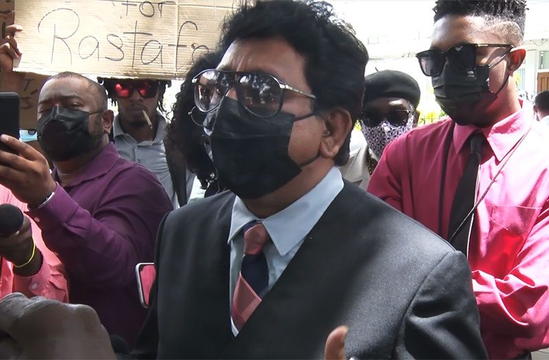 Attorney-General and Minister of Legal Affairs, Anil Nandlall, S.C., addressing the Rastafarians who gathered outside his office in protest, on Monday