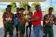 GFF Vice-President Rawlston Adams presents the championship trophy to members of the GDF team (Photo: GFF)