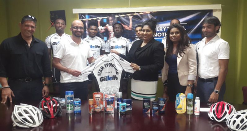 Team ‘Gillette Evolution’ president Keith Fernandes and club members at yesterday’s presentation with Ansa McAl Trading representative.