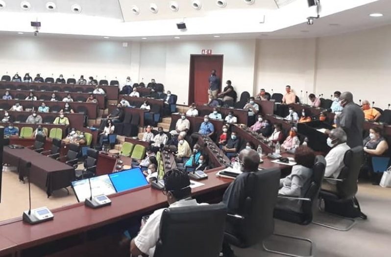 Chief Elections Officer, Keith Lowenfield (standing at right) as he briefed observers, party and GECOM officials earlier today.(GECOM photo)