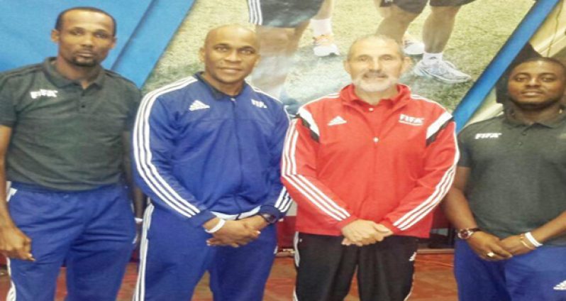 (L-R) Abdullah Hamid, Stanley Lancaster, Fernando Tresaco - FIFA referee development senior manager, and Trevor Beckles.