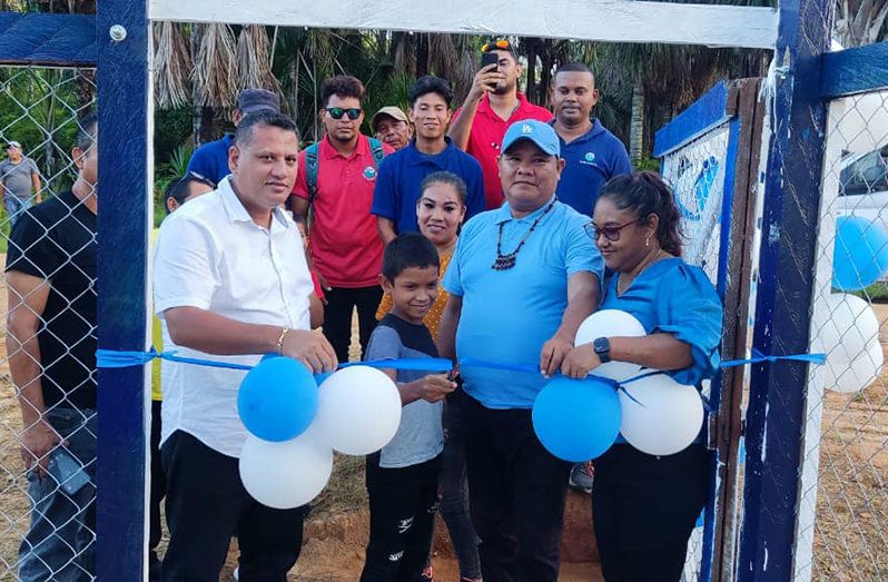 The Minister of Housing and Water, Collin Croal, Regional Officials, GWI representatives, and some of the residents of Kwebanna commissioned a new well