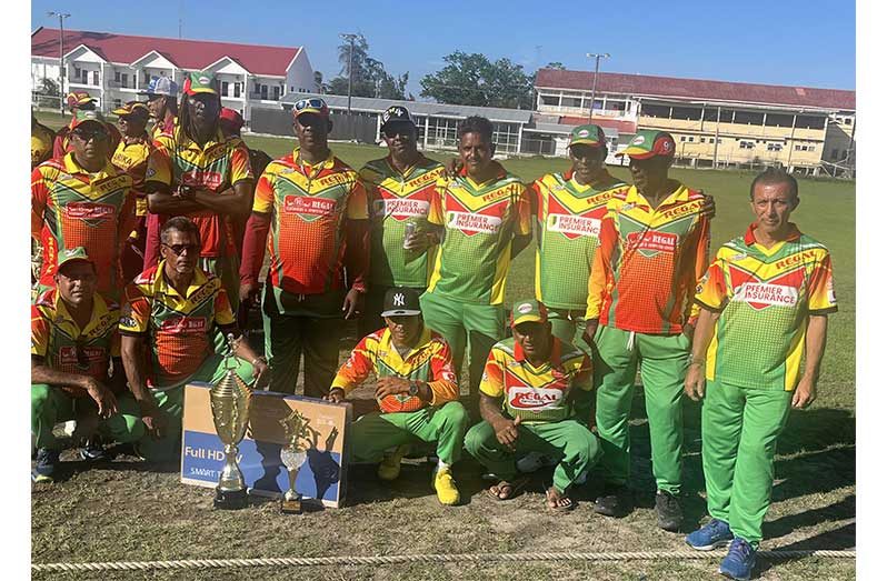 The victorious Regal Legends players pose with their winnings.