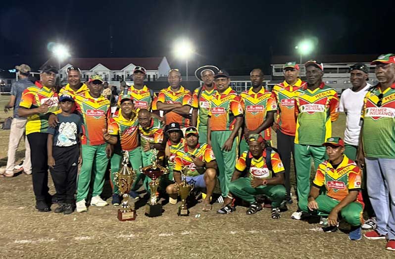 The victorious Regal Legends players and supporters pose with their winnings