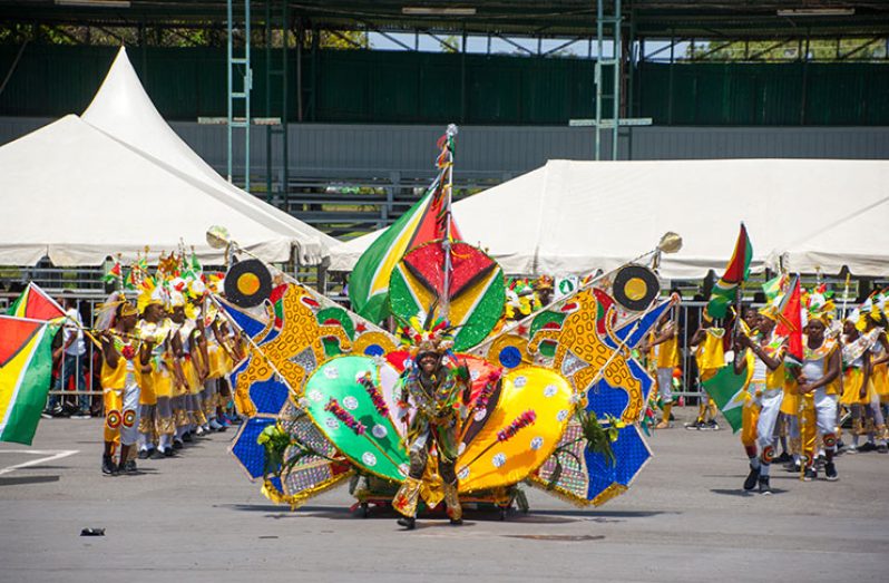 Region Three participants frolic at the National Park yesterday during the
Children’s Mashramani Costume and Float Parade (Delano Williams photo)