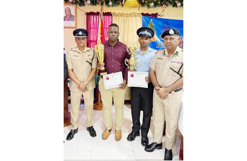 (From right) Deputy Commissioner 'Operations' (ag), Ravindradat Budhram; Best Cop runner-up, Corporal Persaud; Region One Best Cop, Detective Constable Marvin Sam, and Regional Commander, Senior Superintendent Himnauth Sawh