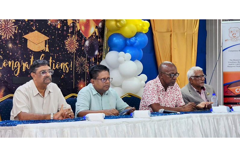 Senior Minister in the Office of the President with Responsibility for Finance and the Public Service Dr. Ashni Singh and other officials at the graduating ceremony of the trainee heavy-duty equipment operators