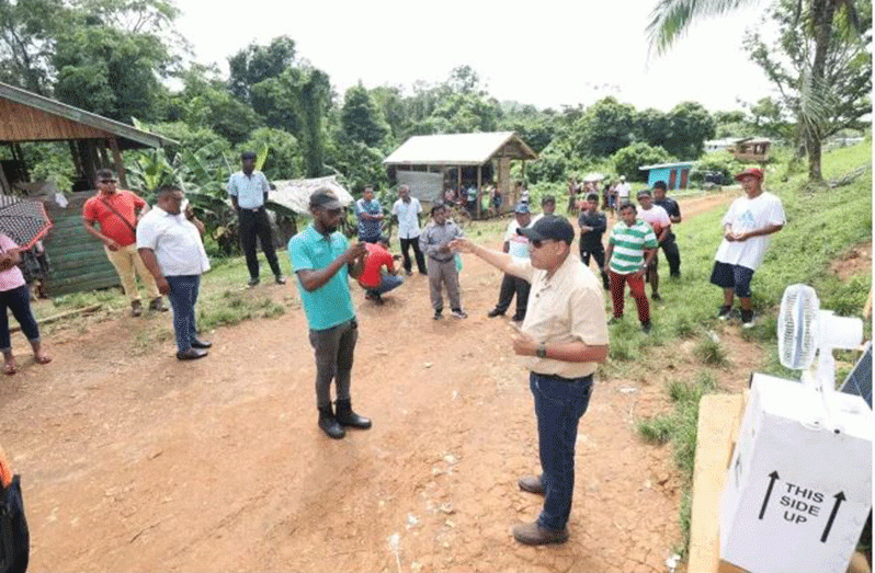 Minister of Housing and Water Collin Croal addressing residents in Region One