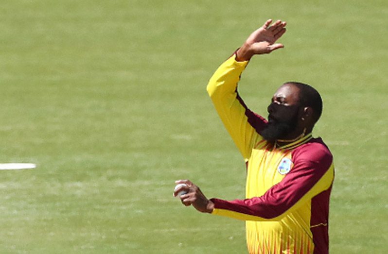 Left-armer Raymon Reifer sends down a delivery during his three-wicket spell. (Photo courtesy CWI Media)