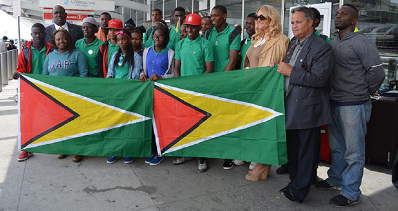 The eighteen teenagers from the Fort Wellington Secondary School stand proudly with the Guyana Flag at the John F. Kennedy International Airport, New York. Also in photograph are: Karen Kraus, Chief Operations Officer Dynamic Airways, Captain Gerry Gouveia, and Rickford Burke Chairman of Guyana’s 50th Independence Anniversary celebrations.