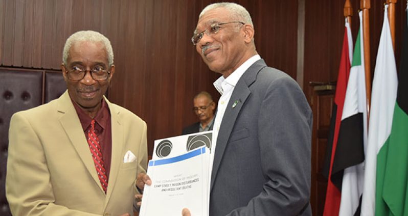President David Granger receives the report of the Commission of Inquiry (CoI) into the Georgetown Prison riots from Chairman of the Commission Justice James Patterson