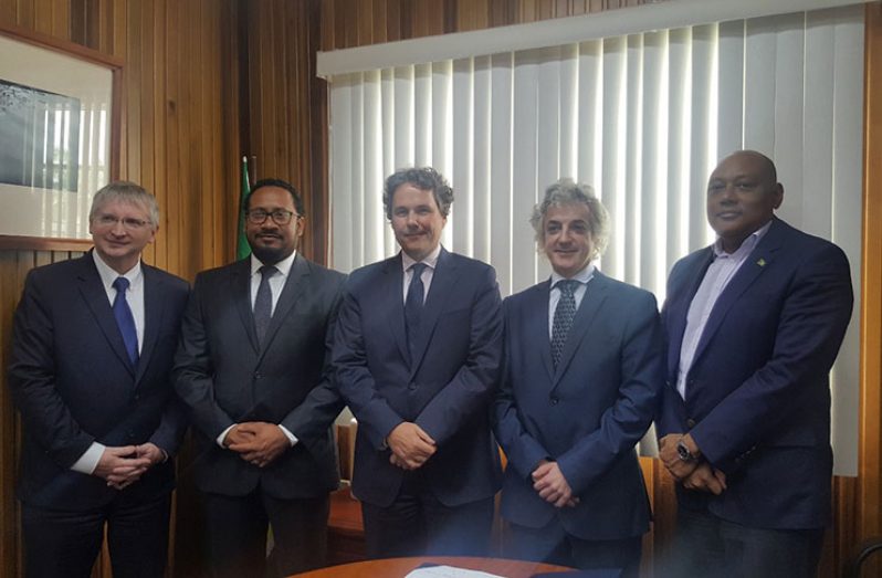Natural Resources Minister Raphael Trotman (extreme right) standing with Repsol’s Director Global New Ventures, Mikel Erquiaga, and other officials of the country