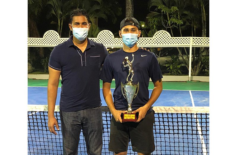Safe Tennis Tournament champion Heimraj Resaul (right) with Minister of Culture, Youth and Sport, Charles Ramson Jr