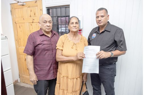 Families from the Mosquito Hall Old Housing Scheme and a section of Plantation Plot A, Mosquito Hall, as they started the process of securing their Certificates of Title