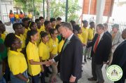 Participants of the Natural Resources Ministry’s Youth in Natural Resources Programme greeting the U.S Congressmen upon their arrival at the Ministry’s Duke Street, Kingston Office on Wednesday