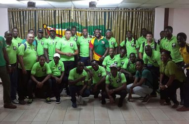 The victorious “Green Machine”team pose for a picture on return home (Delano Williams photo)