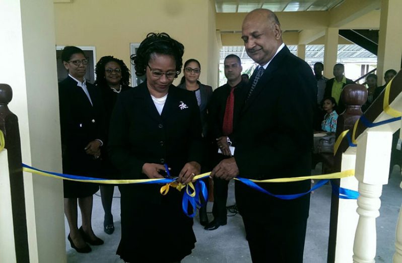Chief Justice Yonette Cummings-Edwards and outgoing Chancellor of the Judiciary (ag), Justice Carl Singh, cut the ribbon to formally re-open the Sparendaam Magistrates Court
