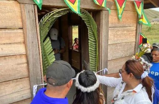 Minister of Amerindian Affairs Pauline Sukhai and residents of Tuseneng cutting the ribbon to commission the craft centre