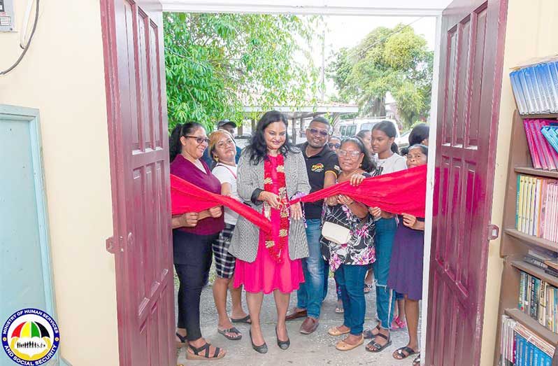 Minister of Human Services and Social Security, Dr Vindhya Persaud, cuts the ribbon to the sewing hub