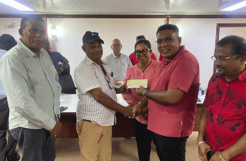 Rice miller Arnold Sankar receives his cheque from Minister of Agriculture Zulfikar Mustapha