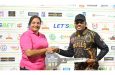 Richie Looknauth collects a ceremonial key for his brand new motorcycle from a representative of Regal Supercentre