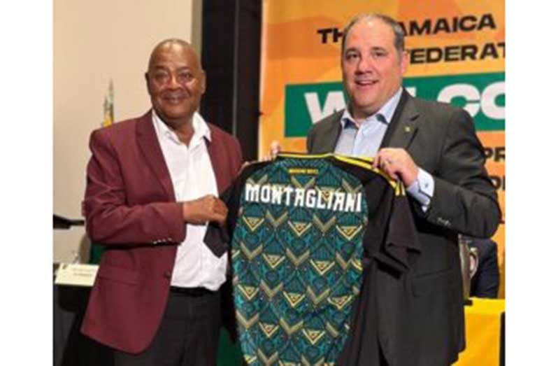 Concacaf President Victor Montagliani (right) and Jamaica Football Federation President Michael Ricketts