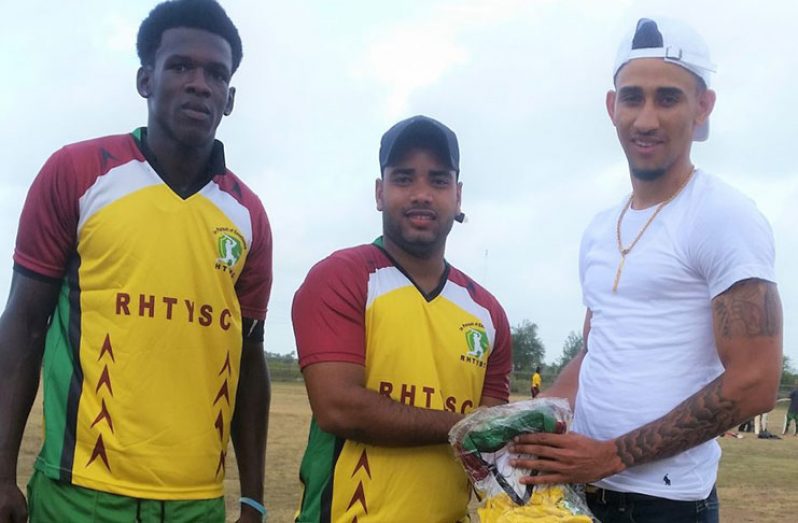 Former RHTY&SC member Dominic Rikhi (right) hands over uniforms to RHTY&SC captain Shawn Perreira, while club member Sylus Tyndall shares the moment.