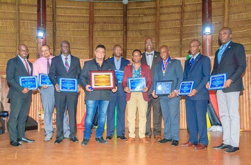 Golden Rule Goodwill Ambassadors pose with their awards alongside Dr. Clyde Rivers (fourth left)