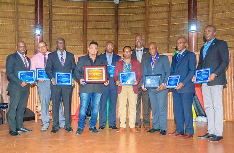 Golden Rule Goodwill Ambassadors pose with their awards alongside Dr. Clyde Rivers (fourth left)