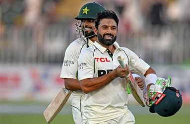 Mohammad Rizwan and Babar Azam walk off the field at stumps • (AFP/Getty Images)