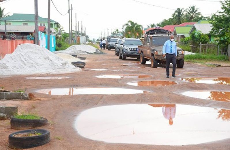 Minister of Public Works, Juan Edghill, inspecting a section of the road to be done in Amelia’s ward, Region 10 (DPI photo)