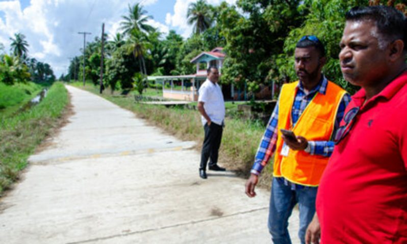 Minister Indar Road inspecting road works in Leguan