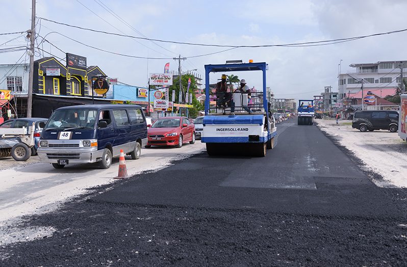 Asphalting works being done on a section of the road (Delano Williams photo)