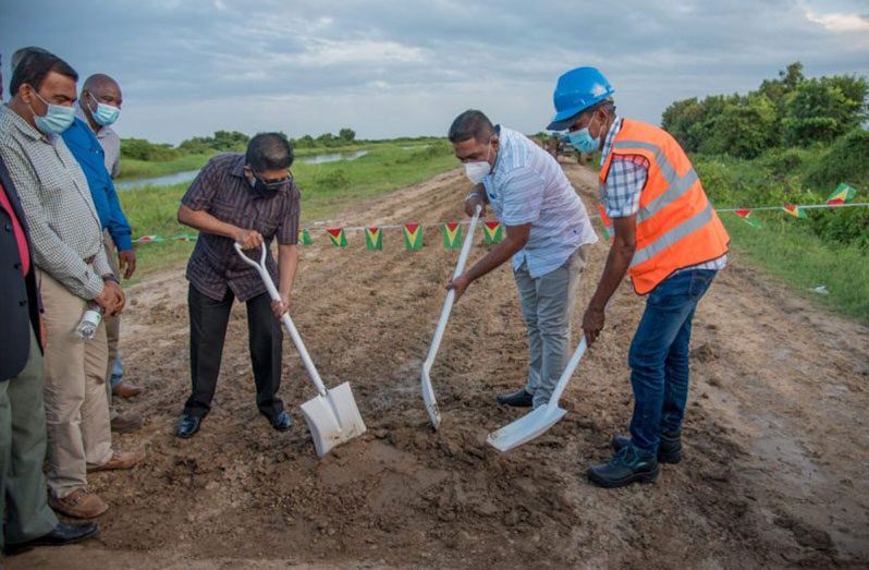 Flashback: Senior Minister in the Office of the President with responsibility for Finance, Dr. Ashni Singh and Agriculture Minister, Zulfikar Mustapha, turn the sod for the start of the road project at Onverwagt, back in February