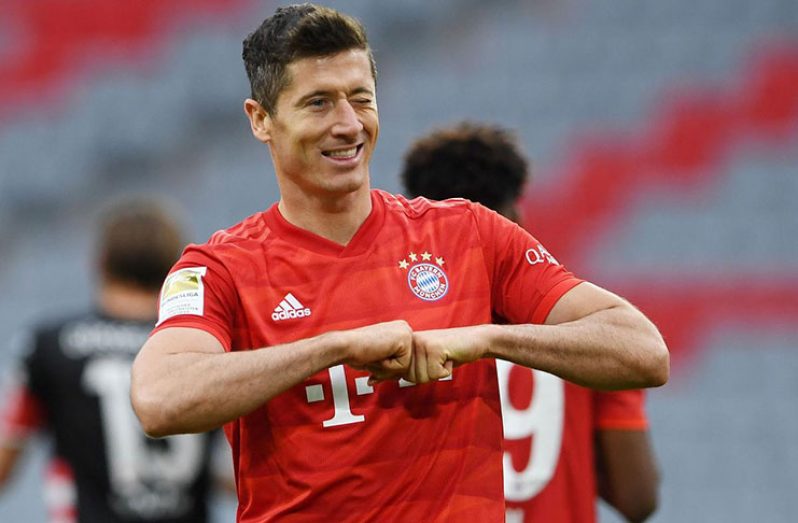 Allianz Arena, Munich, Germany - 0 Bayern Munich's Robert Lewandowski celebrates scoring their fourth goal, as play resumes behind closed doors following the outbreak of the coronavirus disease (COVID-19) Christof Stache/Pool via REUTERS