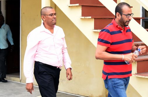 Former Minister of Natural Resources, Robert Persaud, (front) at SOCU’s Headquarters [Adrian Narine photo]